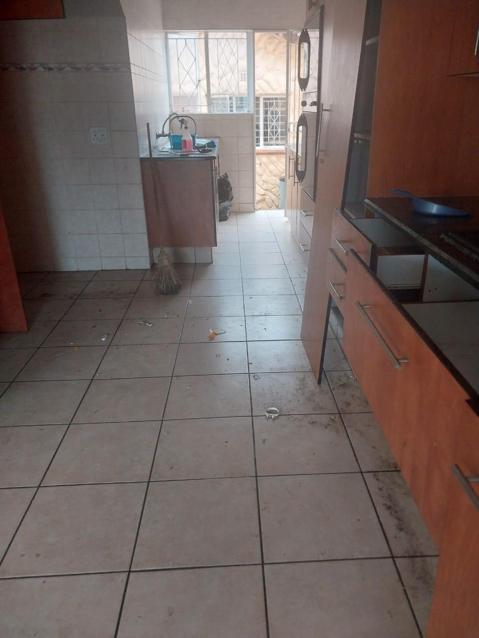 Messy living room before cleaning